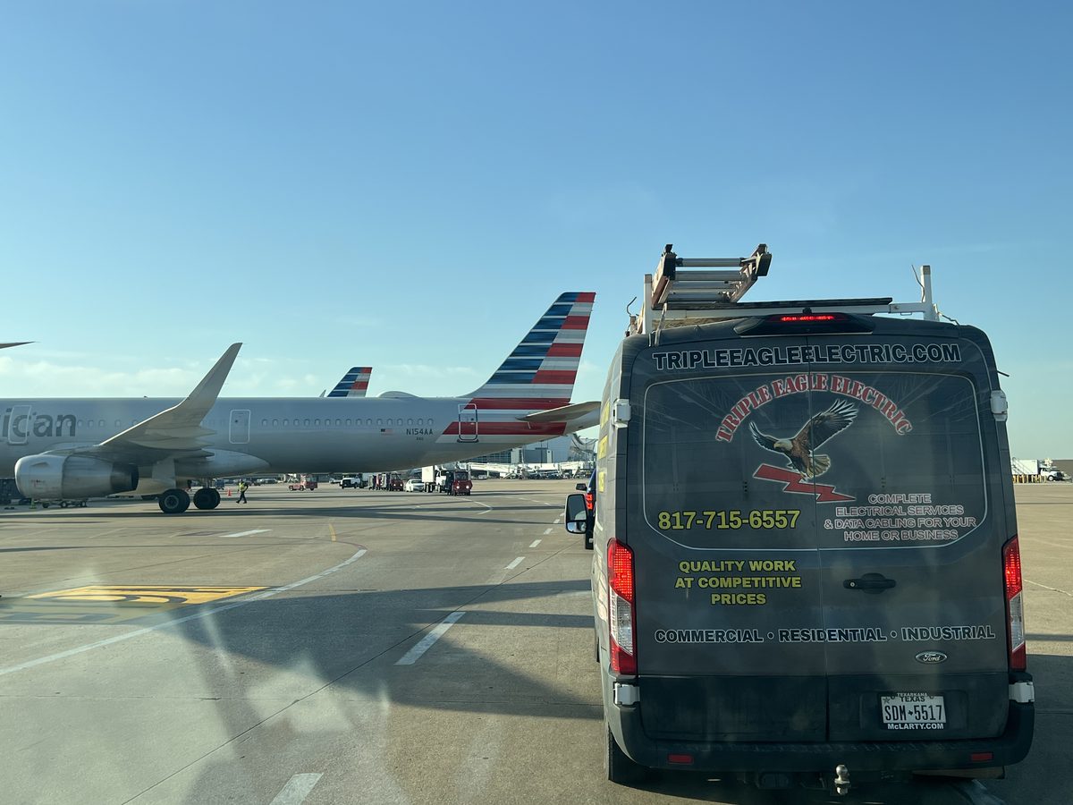 Triple Eagle Electric van at DFW Airport tarmac — TECL #27449 licensed electrical contractor