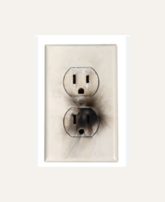 Burnt electrical outlet — call Triple Eagle Electric for emergency service DFW TX